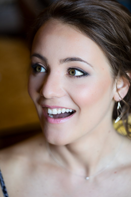 Bridal smiling portrait casual photography during makeup