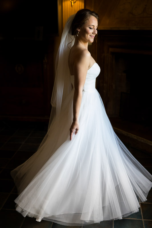 Wedding dress spinning around by the window