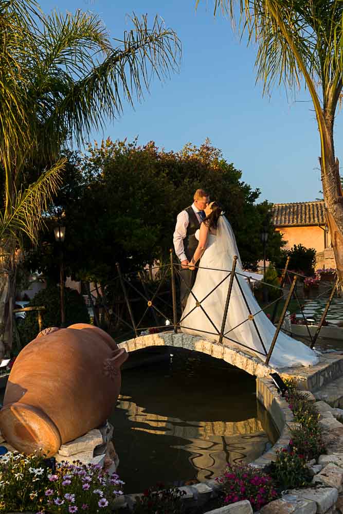 Bride and groom on the villa bridge