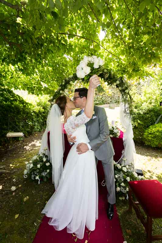 Newlyweds kissing after marriage