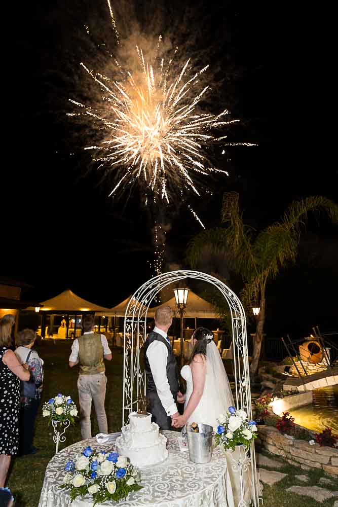 Bride and groom fireworks in the sky