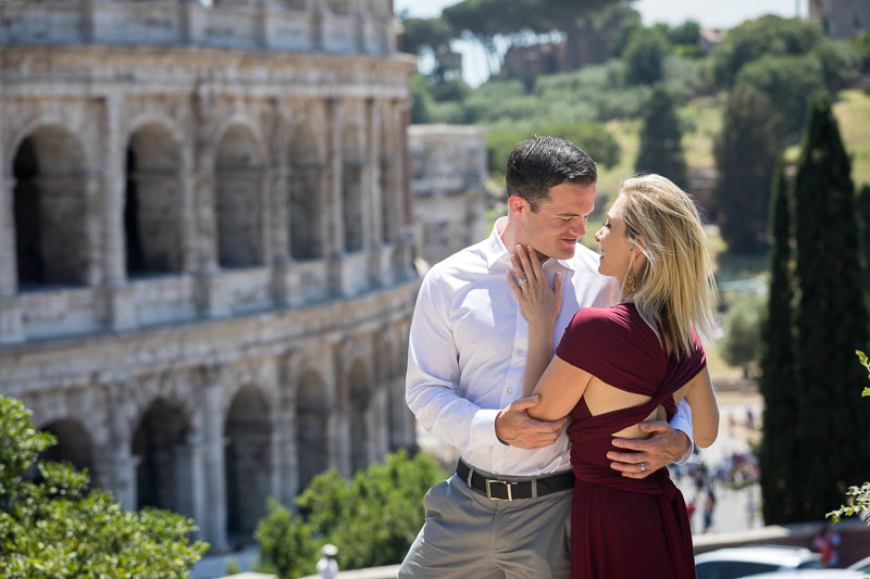 Posing together with the Coliseum in the background