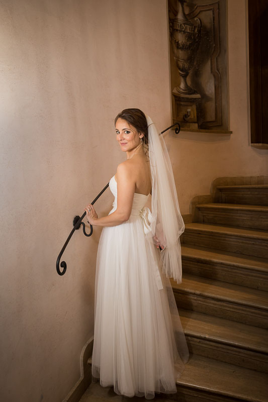 Bridal posing for a portrait on the stairs