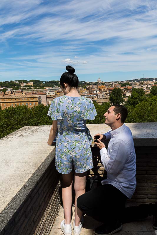 Surprise Proposal with Hidden Photographer overlooking the roman cityscape