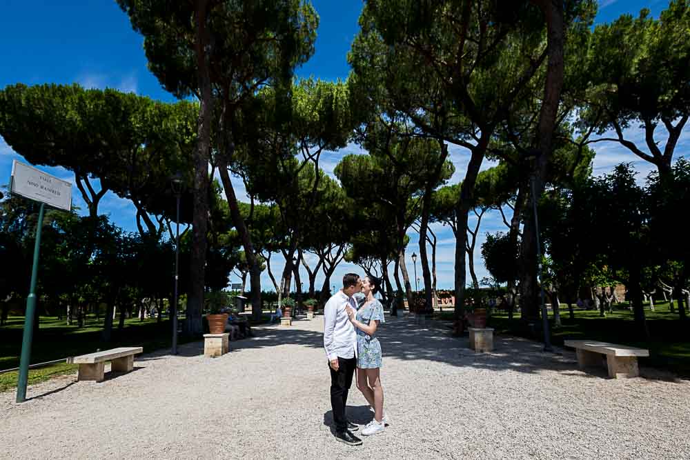 Posed underneath Mediterranean pine trees