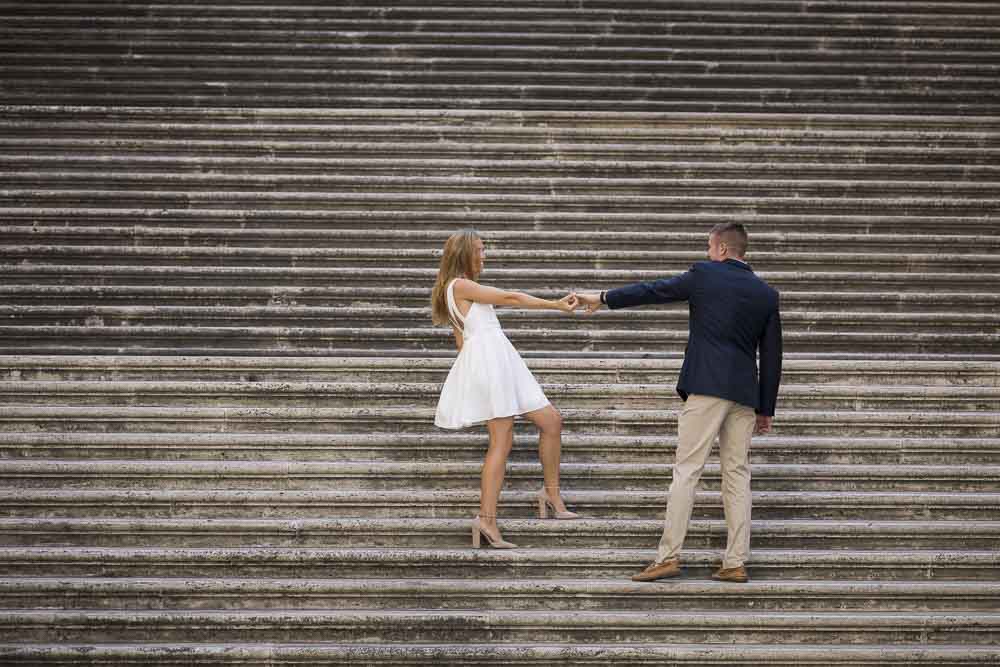 Posing on wide stairs photographed from a distance