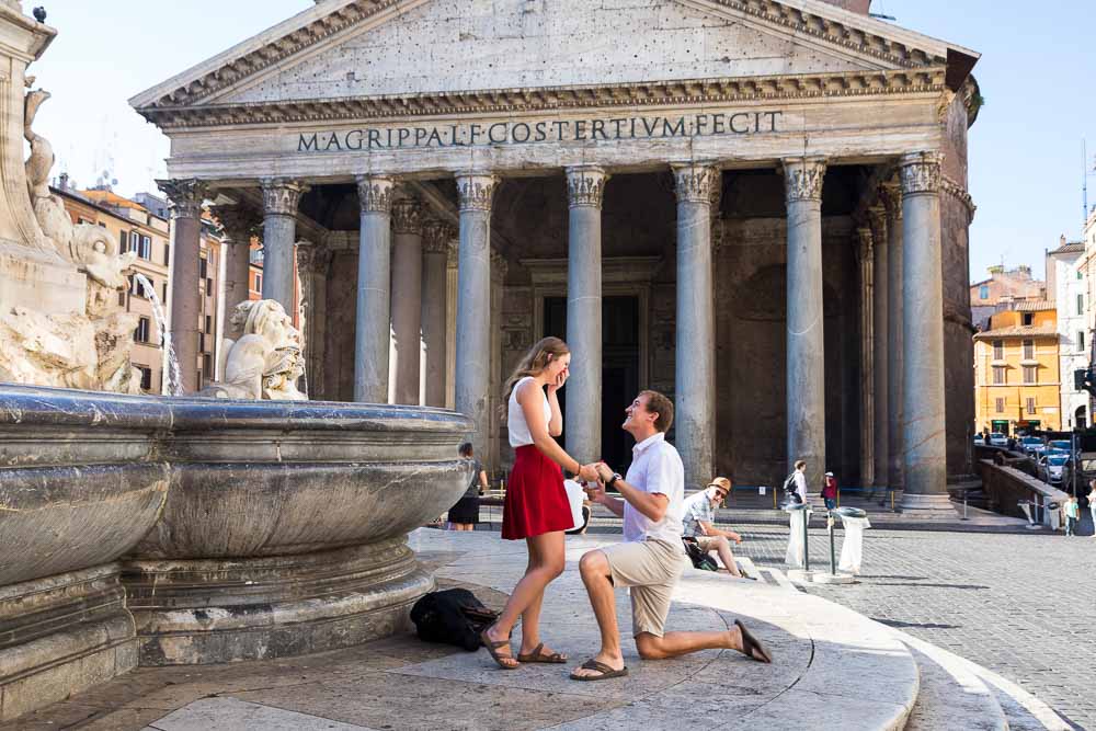 Knee down wedding proposal taking place at the Roman Pantheon in Rome Italy