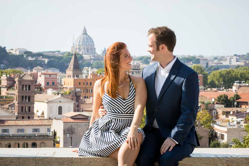 Just engaged posing in the forefront of S.Peter's basilica in the background