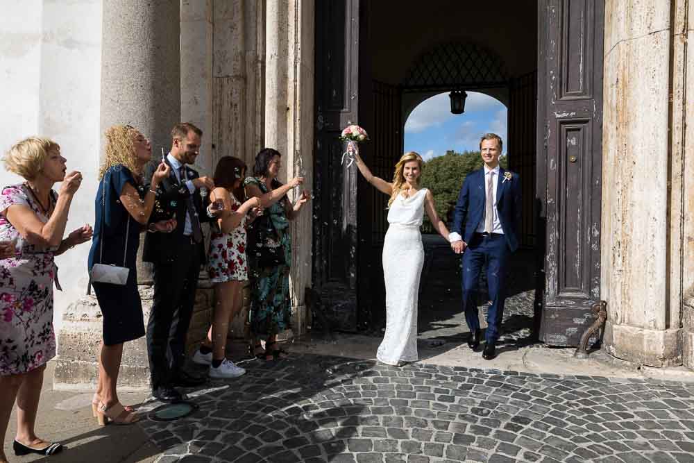 Just married and stepping outside the building