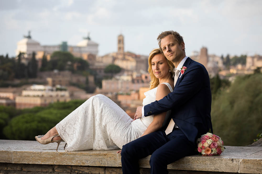 Sitting down before the sweeping view of Rome after the marriage ceremony