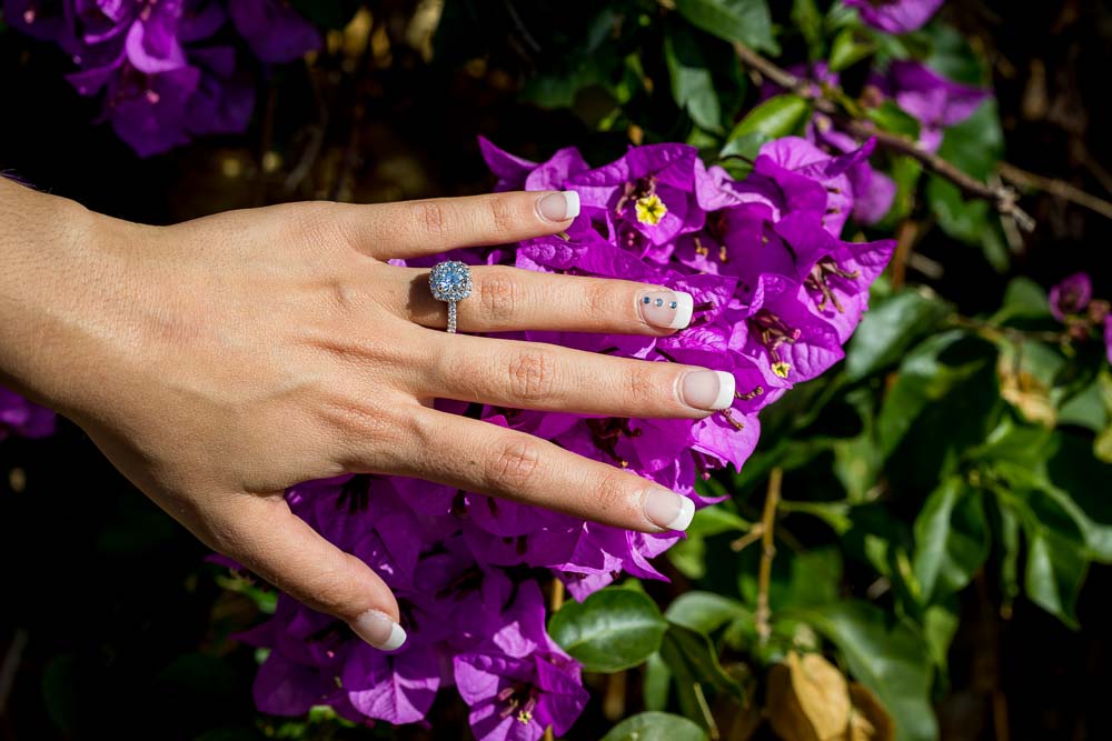 Macro close up engagement ring over purple flowers