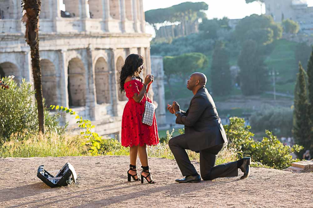 Roman wedding marriage proposal out on a hillside view over the Colosseum