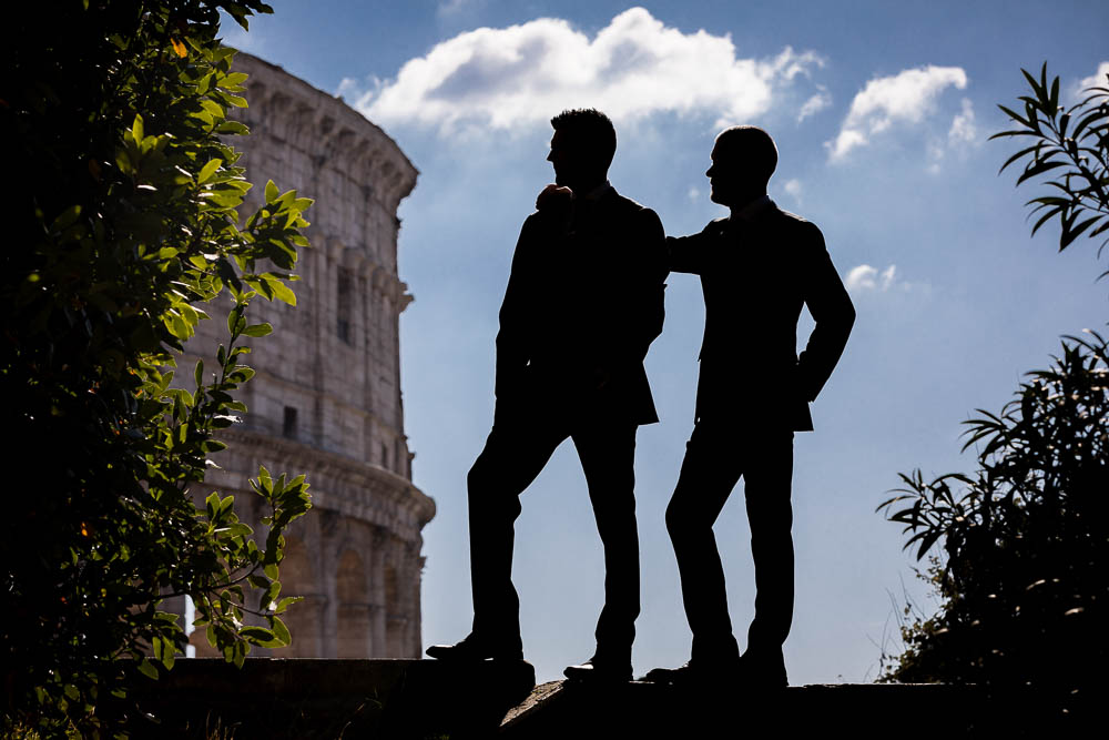 Side ways profile male couple silhouette at the Colosseum