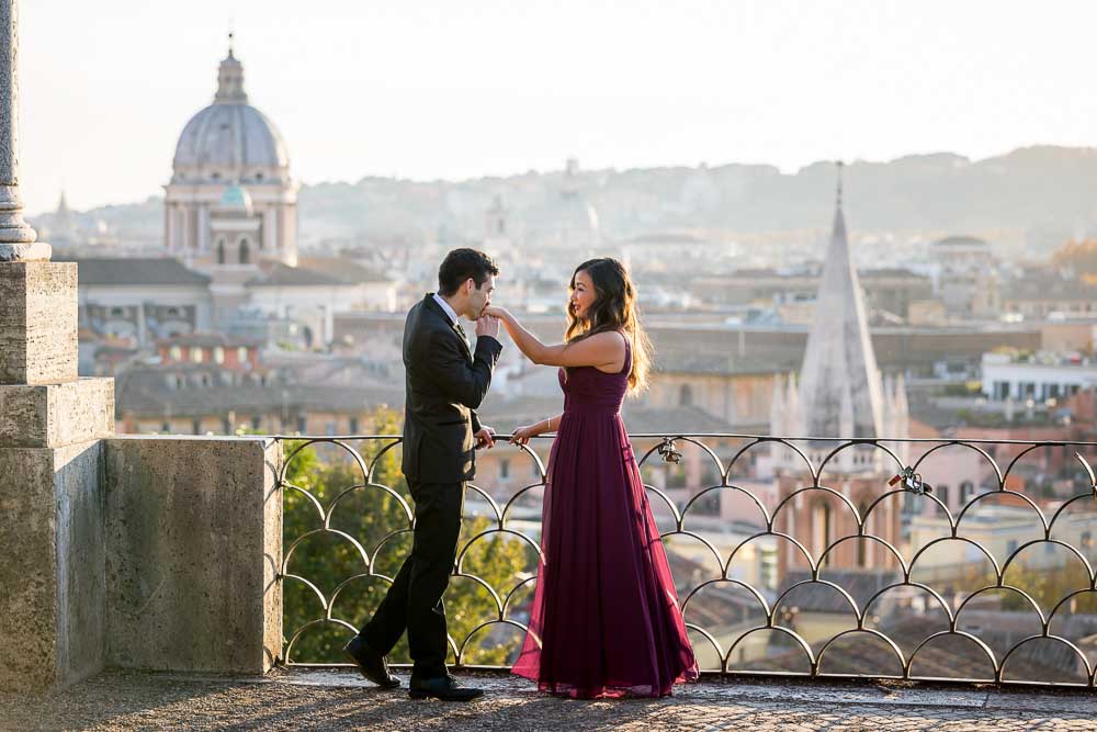 Chivalry gesture gentlemen like during an anniversary portrait session in Rome