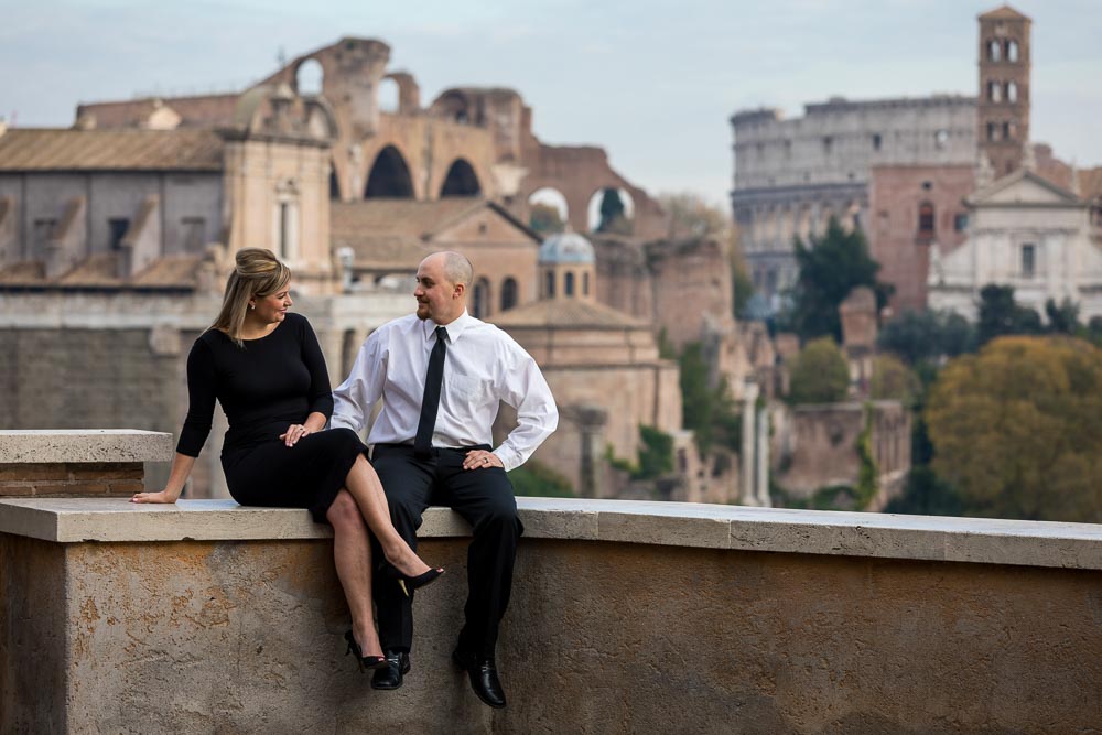 Sitting down pose photo by the ancient roman ruins