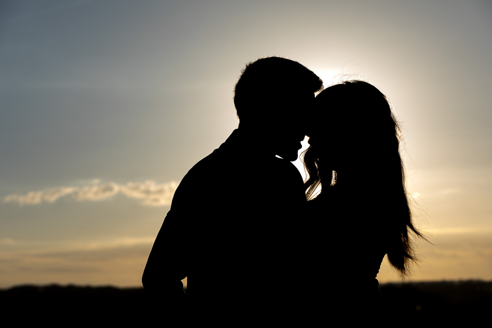Silhouette image of a couple at sunset