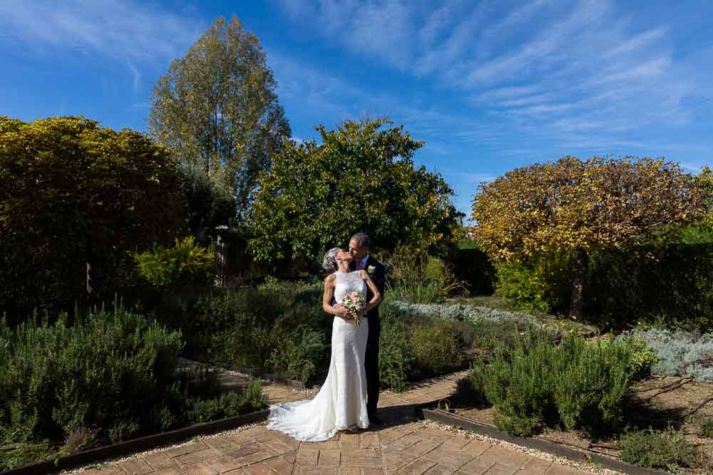 Bride and groom together in a park taking Elopement Wedding photos in Tuscany