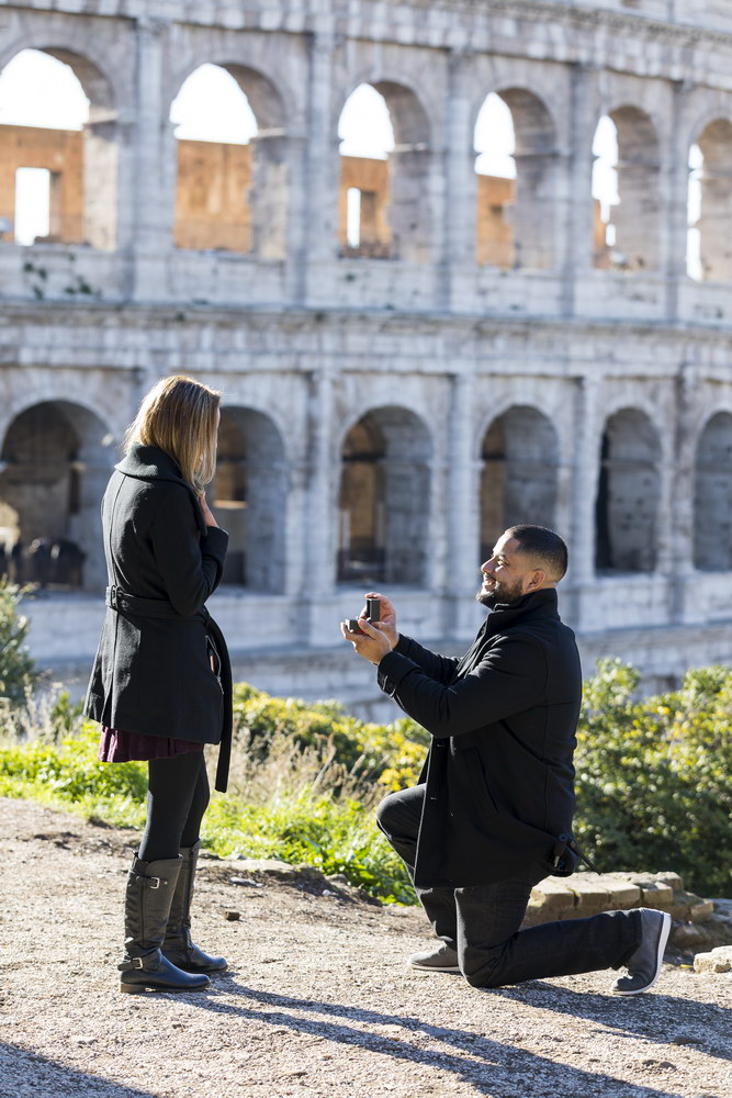 Knee down wedding marriage proposal at the Roman Colosseum