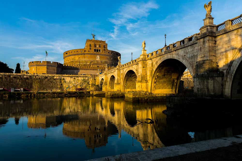 Castel Sant'Angelo bridge in Rome at sunset. the closet location in walking distance from the St Peter's square.
