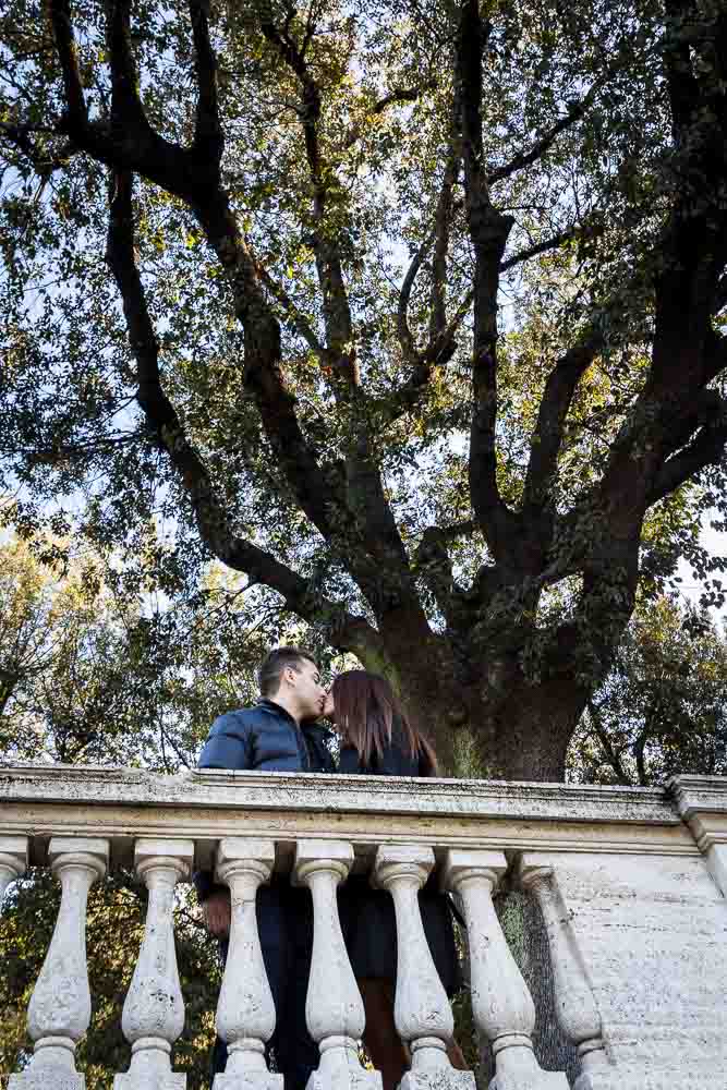 Romantic kiss under tree