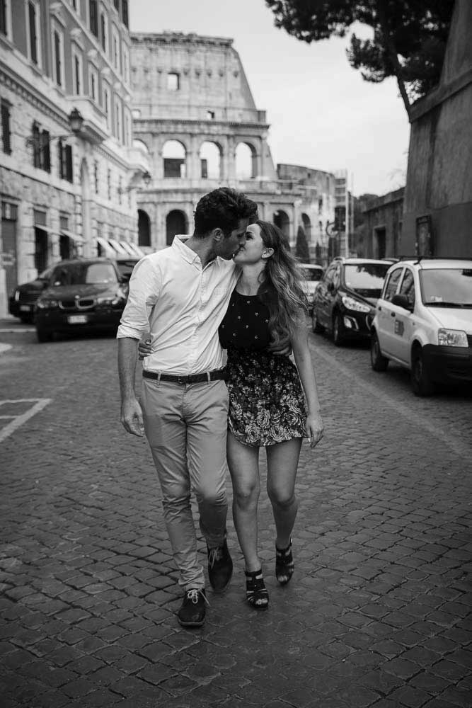 Couple walking in the streets of Rome during an Italy Photographer session in Rome. Image in bw post processing touch up.