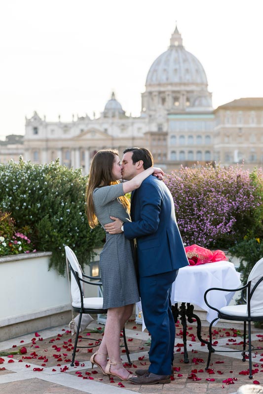 Couple kissing with Saint Peter's dome in the far distance