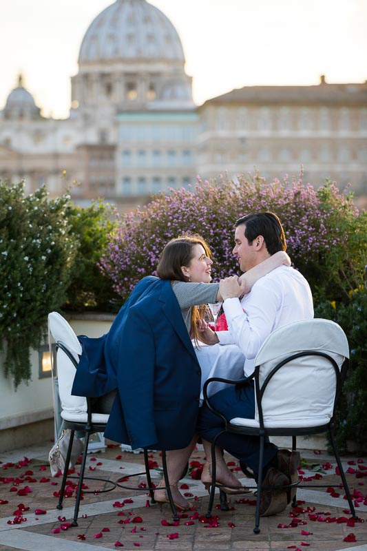 Happy together on a terrace with a scenic roman view