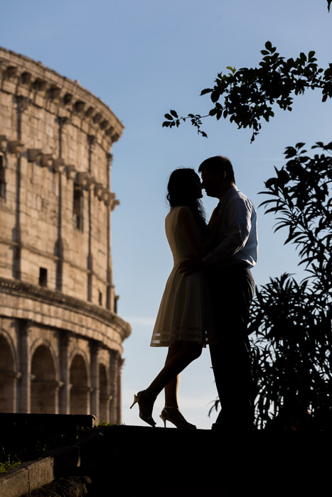 Posed image in front of the Roman Colosseum in silhouette