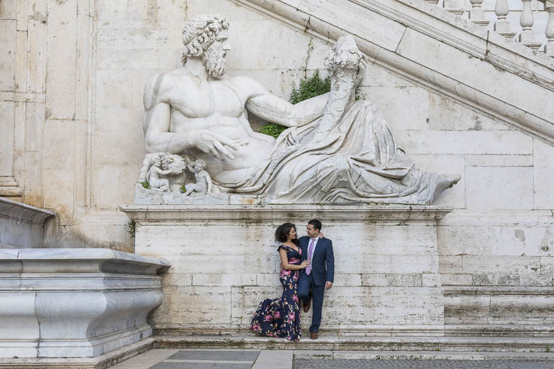 Portrait picture taken below an ancient marble statue in Piazza del Campidoglio