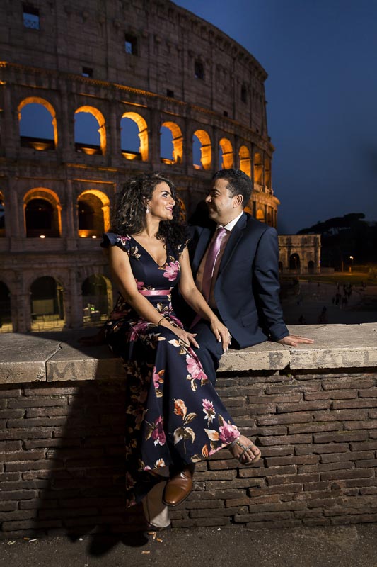 Sitting down on a ledge at night in Rome Italy