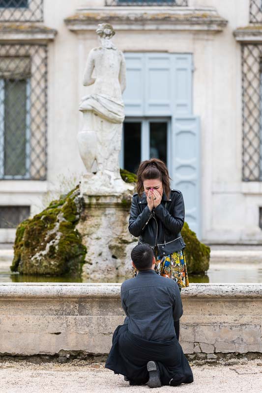 Knee down same sex lesbian surprise wedding marriage proposal photographed in a beautiful garden in Rome