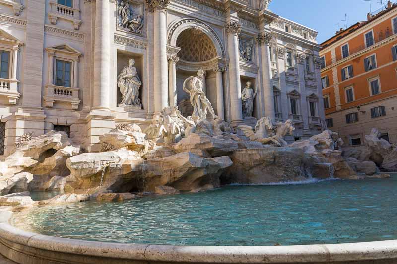 A picture of the Trevi fountain photographed in the early morning as the light started to shine through