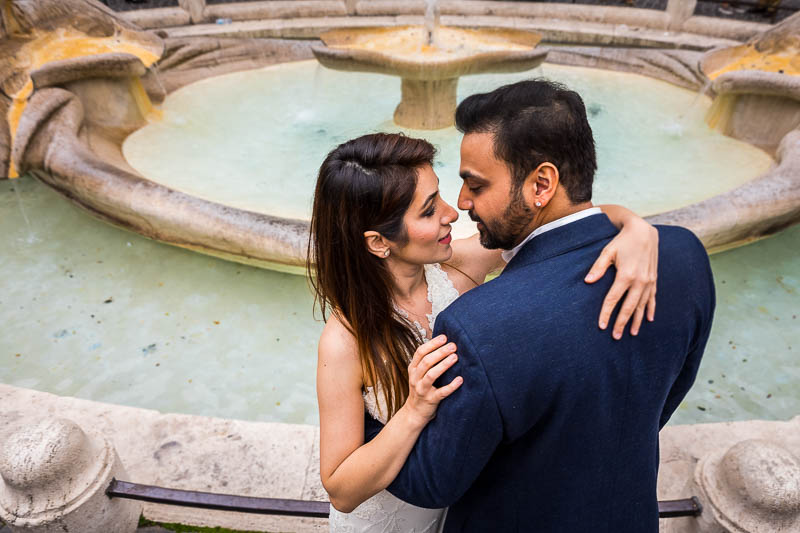 Portrait couple picture taken at the Barcaccia water fountain in Rome Italy