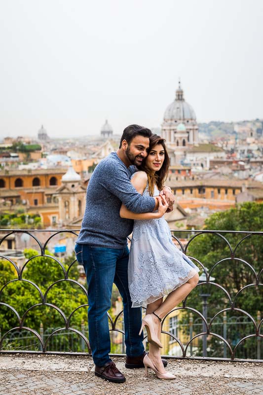 Together overlooking the city of Rome from the above Parco del Pincio terrace view