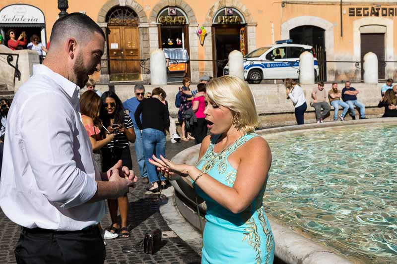 Putting the engagement ring while on the edge of the water