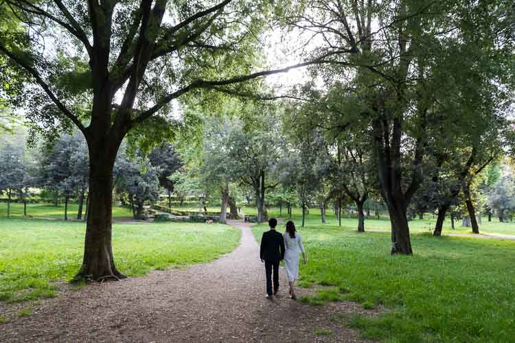 Walking in the park together during a pre wedding photo session