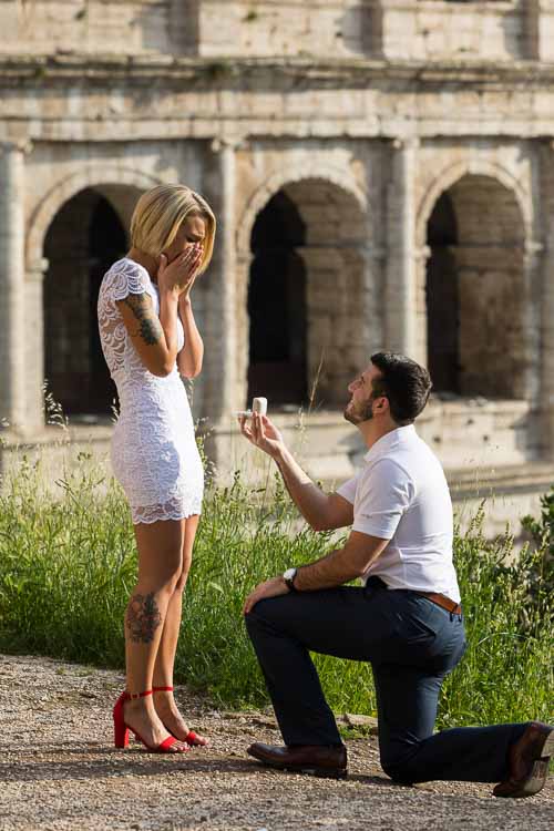 knee down wedding proposal at the Coliseum in Rome Italy