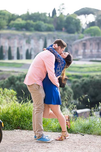 kissing couple at the Coliseum with the forum in the background