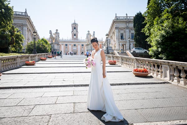 Bride standing on the staircase leading into Capidoglio square