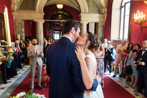 Newlyweds kissing right after exchanging their vows