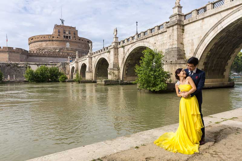 Taking pictures down below the Tiber river with Castel Sant'Angelo bridge in the far distance