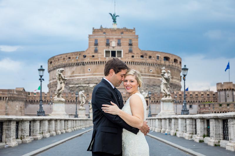 Just married taking pictures on the Castel Sant'Angelo bridge and castle