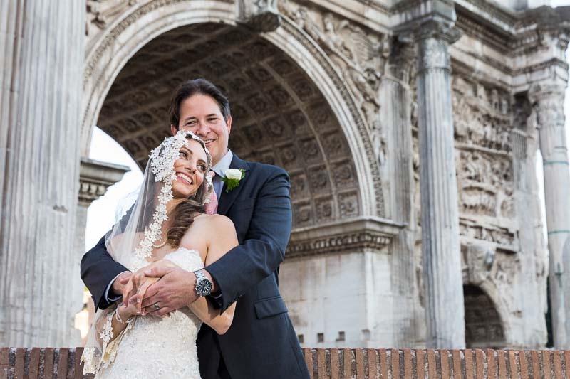 Nuptial portrait under old arch