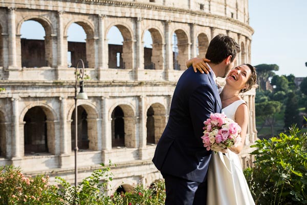 Bride and groom taking nuptials pictures at the Roman Colosseum