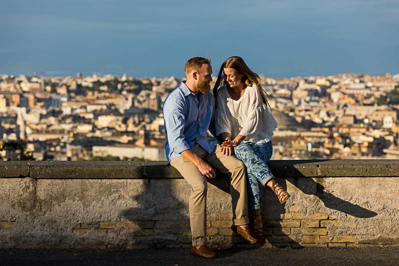 Couple looking at the engagement ring after the big surprise