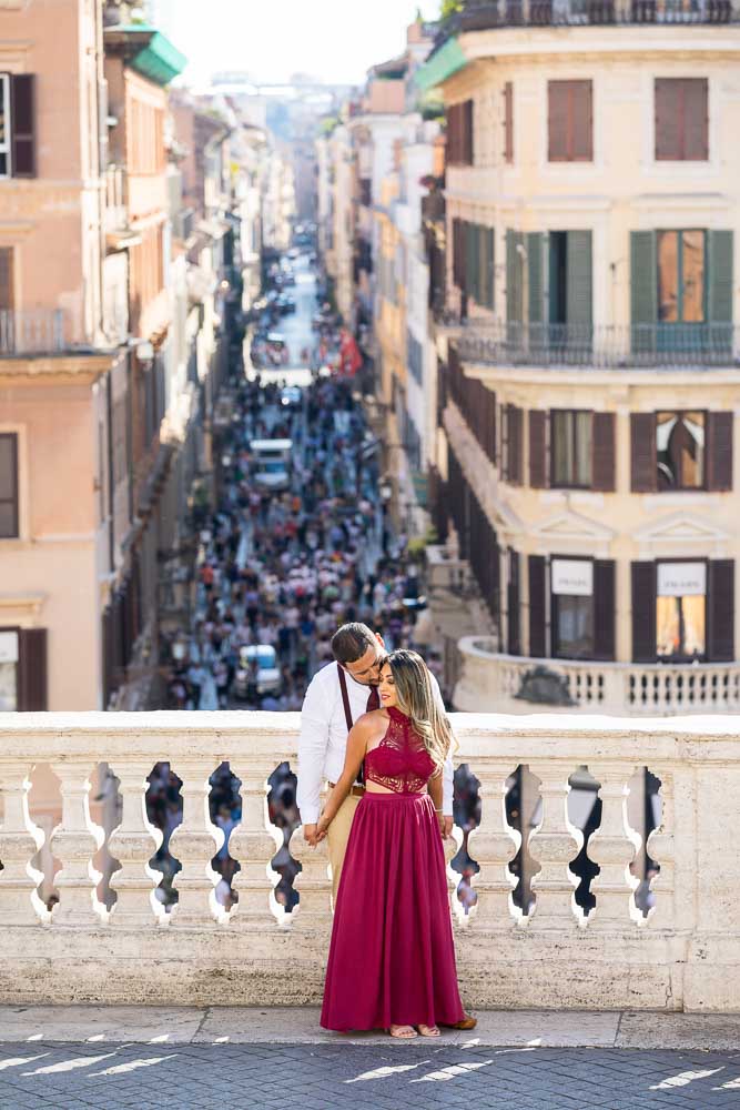 Posed standing on the Spanish steps balcony overlooking via Condotti in the far distance. Romantic picture of being together. 