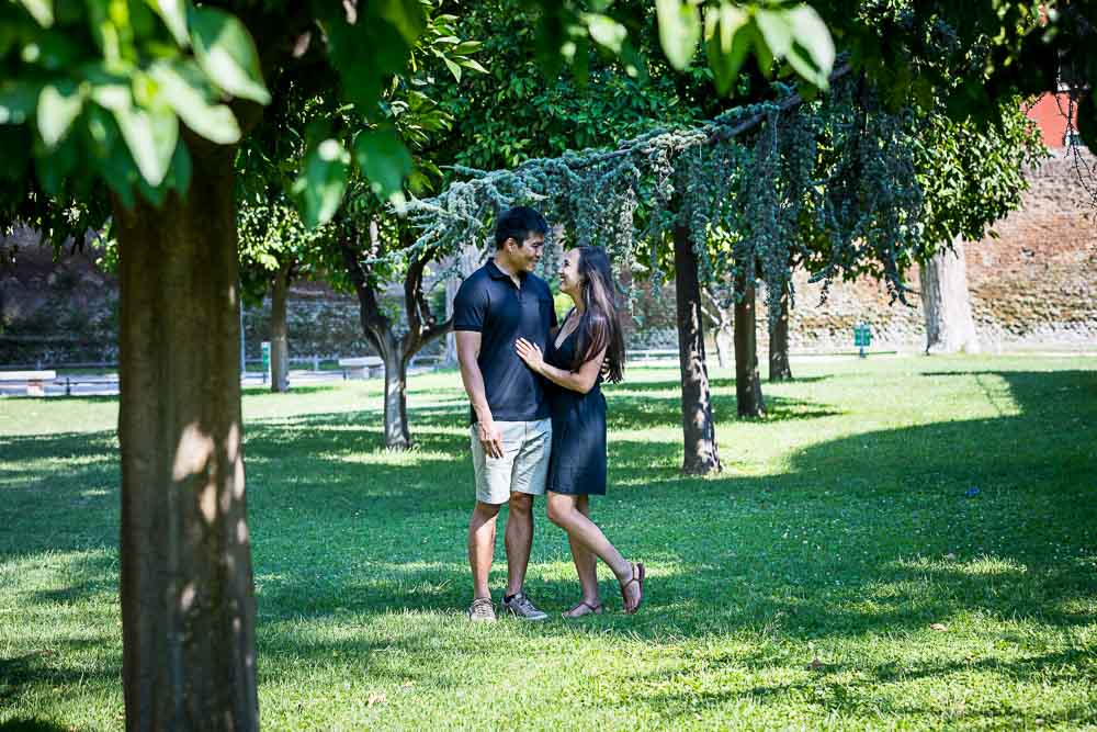 Taking couple pictures in the green park