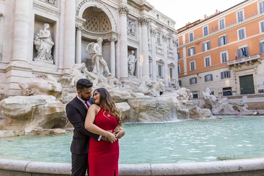 In love at the Fontana di Trevi. Water edge engagement image