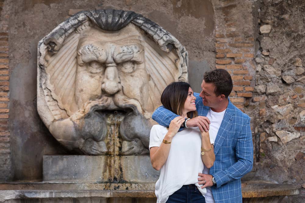 Portrait picture together before a marble water fountain statue