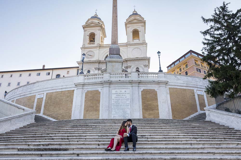 Sitting down image of a couple at Piazza di Spagna